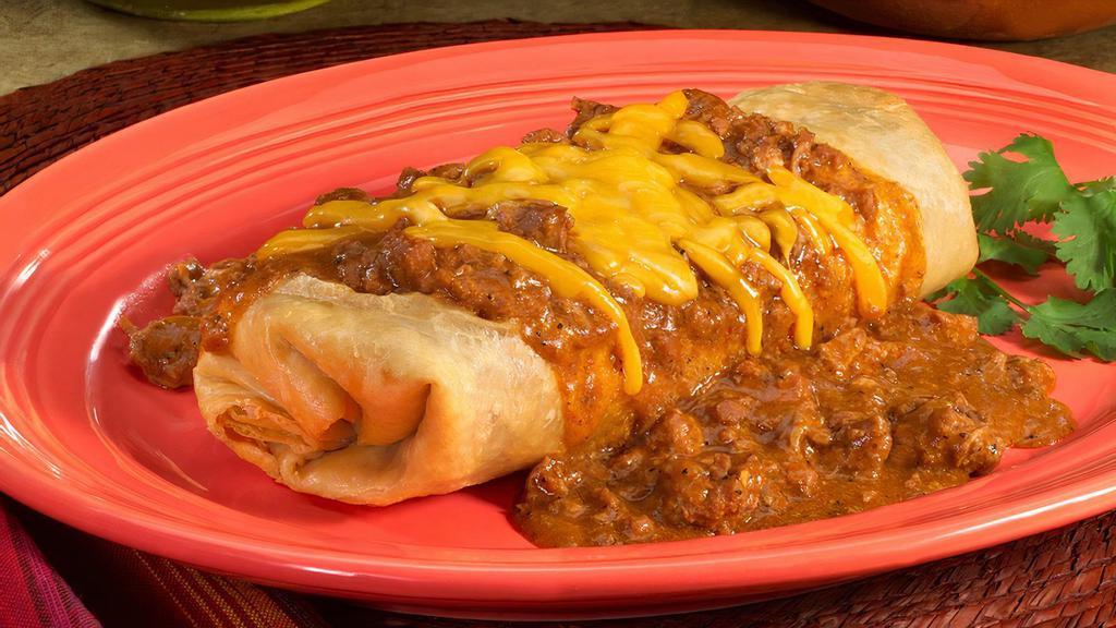 Texas Fried · A nicha's original since 1977! Tortilla filled with beans, cheese, your choice of meat (picadillo, carne guisada, al carbon or beef or chicken fajita), topped with chili con carne and cheese.