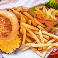 Hamburger · Our classic juicy beef burger served with lettuce, tomatoes, pickles and french fries on the...