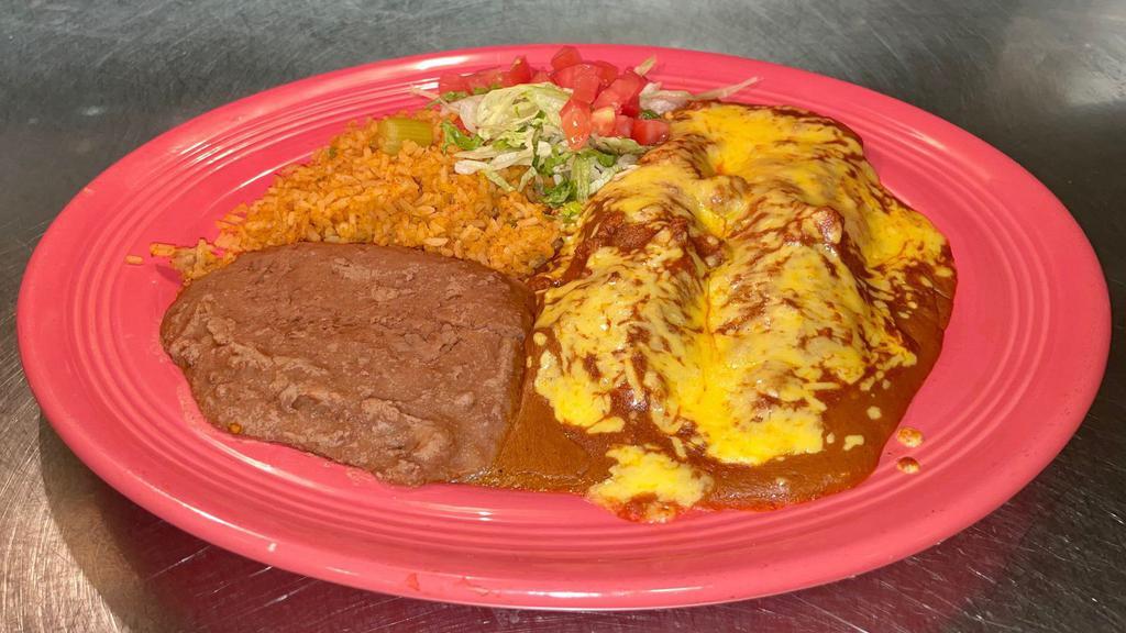 Nicha'S Enchilada Plate · A nicha's tradition! Two cheese enchiladas covered with our familia's special sauce and chili con carne.