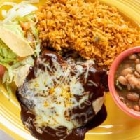Chicken Mole Enchiladas · Two chicken enchiladas topped with our mole sauce (contains peanuts) and Monterrey Jack chee...