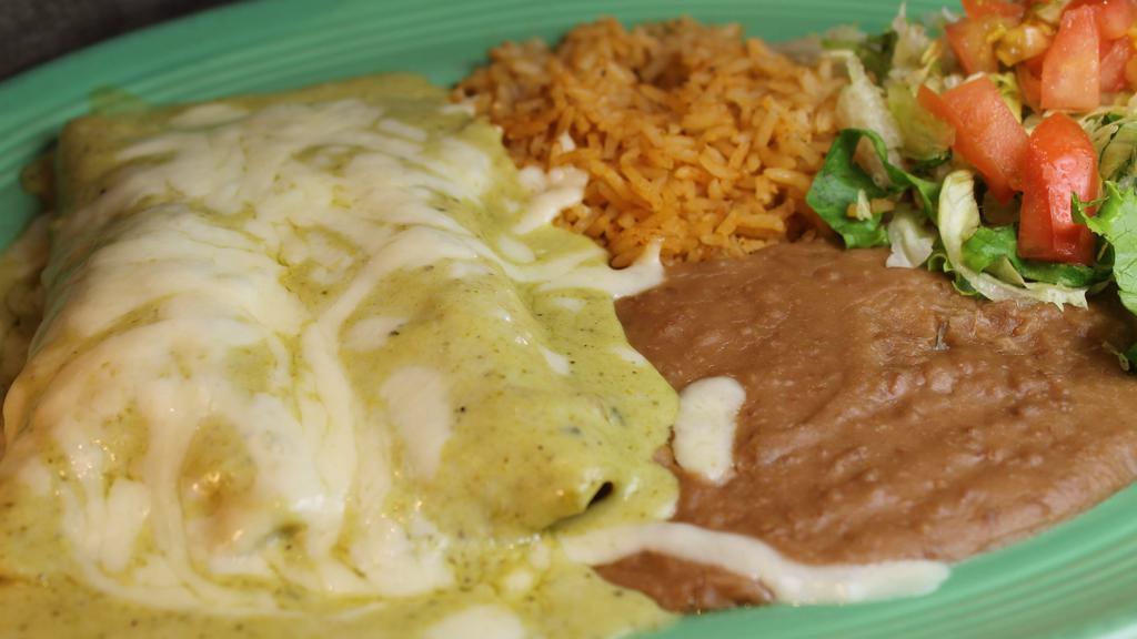 Poblano Enchiladas · Two chicken enchiladas topped with a roasted poblano cream sauce and Monterrey Jack cheese.