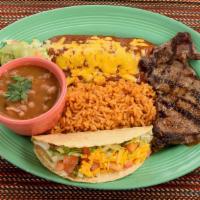 Tampiquena Plate · One 5oz. ribeye steak, one cheese enchilada and a crispy beef taco, served with guacamole sa...