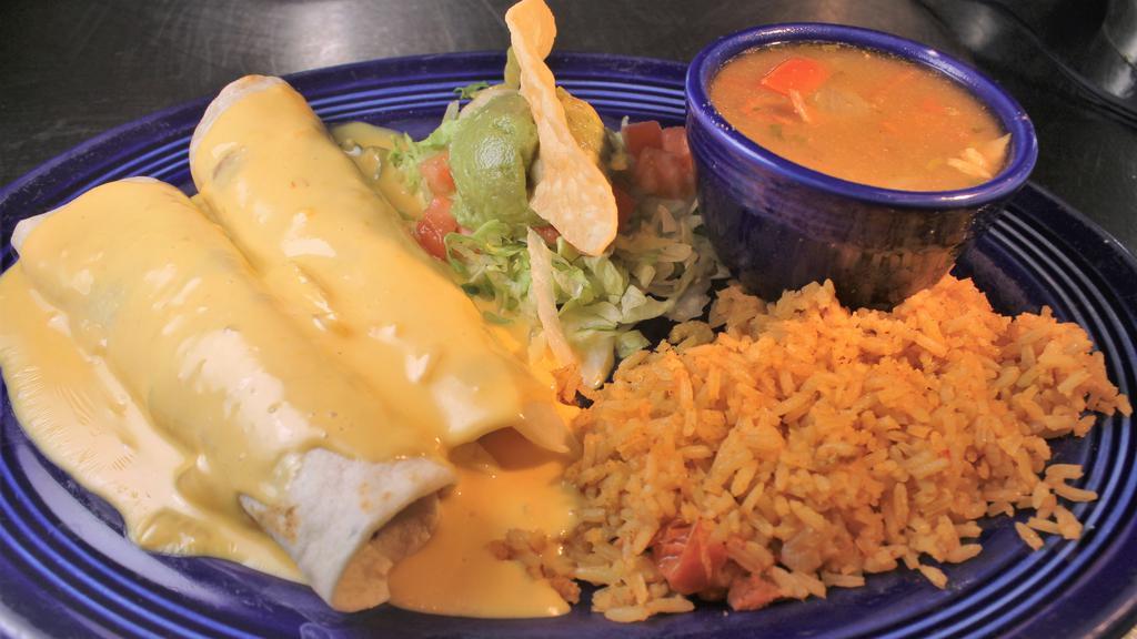 Fajita Fiesta · Make your meal a fiesta! Two flour tortillas rolled and filled with beef or chicken fajita, and topped with queso, guacamole salad and charro beans served on the side.