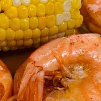 Louisiana Shrimp · 1/2 libra de camarones estilo crawfish, acompañados de 2 papas y 2 elotes. / 1/2 pound of cr...