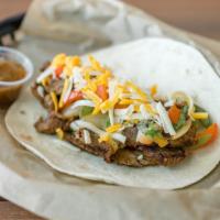 Beef Fajita · Marinated & grilled skirt steak with grilled onions and peppers topped off with shredded che...