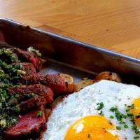 Steakin’ Me Creggsy · Eight-ounce flat-iron steak with chimichurri sauce, two eggs (your way), and potato & bell-p...