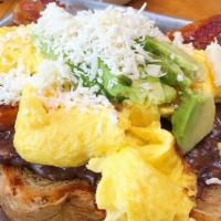 All-Day B.A.E. · Bacon and two eggs with queso fresco, avocado slices, and black-bean spread over toasted rye...