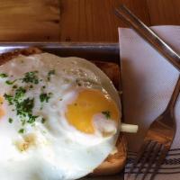 Always Sunny · Grilled sausage, provolone, cheddar, and swiss topped with sunny-side-up eggs over toasted b...