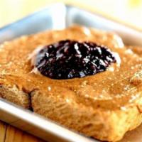 It’S My Jam · Raspberry jam, butter, and choice of almond or peanut butter on toasted 9-grain. Honey can b...