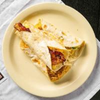 Breakfast Tacos · Six inch flour tortilla with eggs.