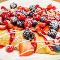 Very Berry Crepes · Fresh strawberry, blackberries, blueberries and raspberries stuffed into our crepes and dust...