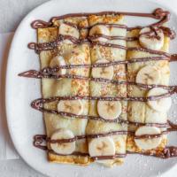 Strawberry Banana Nutella Crepes · Stuffed and topped with strawberry, bananas and nutella.