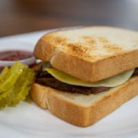 Brisket Sandwich · Includes:
Texas Toast - Mustard - Pickle - Swiss Cheese