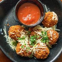 Fried Mac And Cheese Bites · Served with marinara sauce and garnished with parmesan cheese (50 pieces).