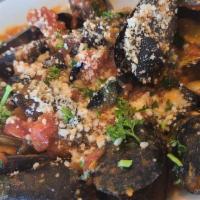 Mussels Marinara · Mussels sautéed with garlic, sherry wine and plum tomatoes. Served with homemade fresh bread.