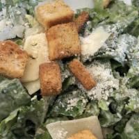 Caesar Salad · Crisp romaine lettuce tossed with fresh caesar dressing topped with shaved pecorino romano a...