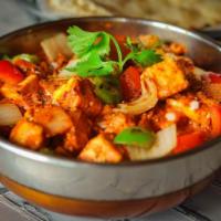 Kadhai Curry · Hearty tomato curry with roasted cilantro. Spicy. Gluten free.