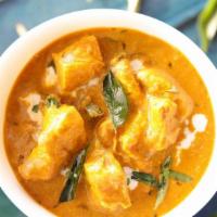 Coconut Chicken Curry · Creamy coconut chicken tempered with curry leaves