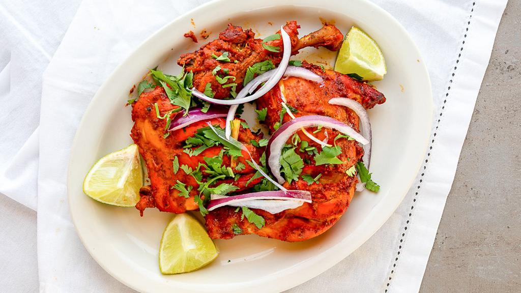 Chicken Tikka (Leg Quarter) · Skinless chicken leg quarter marinated in our aromatic herbs and spices, charcoal grilled.