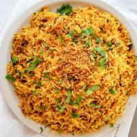 Chicken Biryani · Aged basmati rice cooked over chicken meat marinated in spices then richly flavored with saf...