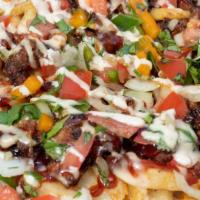 Swamp Fries · French fries topped with chopped brisket, pico de gallo, BBQ sauce, and gator flavor.