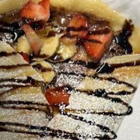 Nutella, Banana, & Strawberry Crepe · with a drizzle of chocolate and caramel sauce on top, and a sprinkle of sugar!