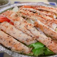 Grilled Chicken Salad · Served with mix of romaine, iceberg, red cabbage topped with tomatoes, onions, cucumbers, an...