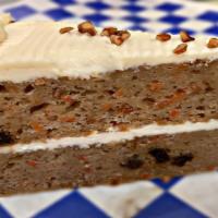 Carrot Cake · Gourmet carrot cake with layer of sweet and tangy cream cheese frosting.