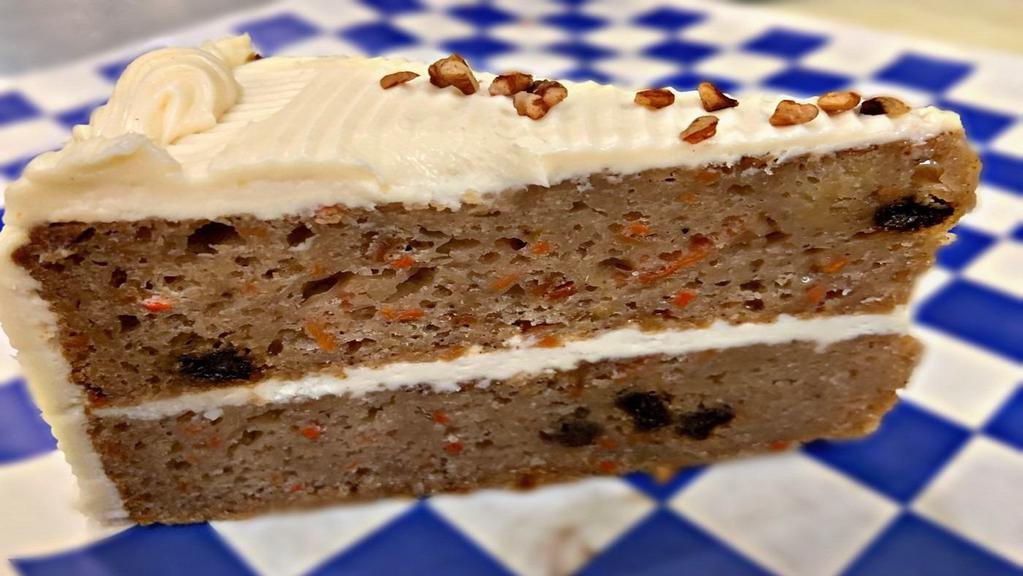 Carrot Cake · Gourmet carrot cake with layer of sweet and tangy cream cheese frosting.