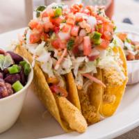 Fried Catfish Tacos · Three crispy corn tortillas stuffed with fried catfish, , pico de gallo, coleslaw, and comeb...