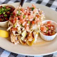 Grilled Tilapia Tacos · Three crispy corn tortillas stuffed with grilled tilapia,, pico de gallo, coleslaw, and come...