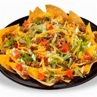 Nacho Deluxe · Large platter of crisp fresh tortilla chips covered with seasoned beef, refried beans, nacho...