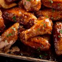 Tavern Wings · Tossed in your choice of sauce and served with a choice of ranch, bleu cheese, or sriracha r...