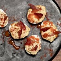 Deviled Eggs · Smoky bacon, hint of jalapeño, and paprika.