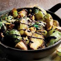 Crispy Brussels Sprouts · Crispy-fried sprouts tossed with chopped bacon, garlic, shallots, Parmesan cheese, and balsa...