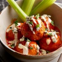 Buffalo Chicken Meatballs · Chicken meatballs tossed in Frank’s Red Hot® sauce and served with bleu cheese, carrots, and...