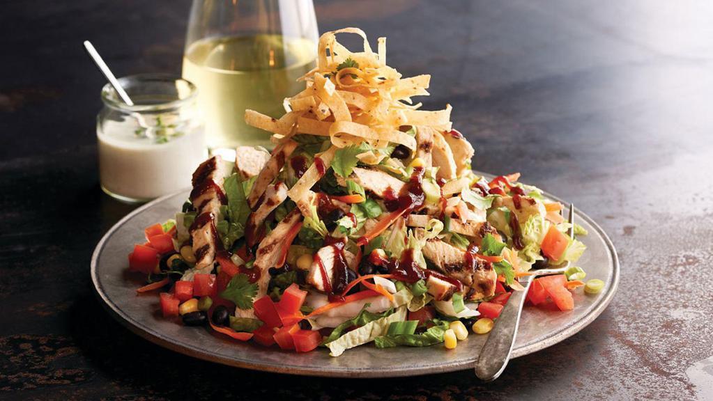 Bbq Chicken Salad · Grilled chicken with roasted corn, black beans, jicama, tomato, green onions, cilantro, and crisp corn tortilla strips. Topped with house-made ranch dressing and whiskey BBQ sauce.