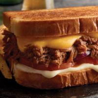 Pulled Pork Grilled Cheese · Barbecued pulled pork, Provolone, and cheddar cheeses, tomato and red onion. Served on count...