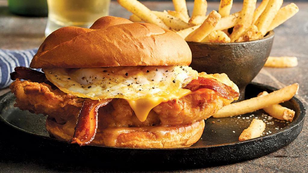 The Dilemma · Hand-breaded chicken breast topped with miso maple butter, white cheddar, an over-medium fried egg, and bacon.