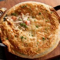 Chicken Pot Pie (Baked Fresh Daily) · Pulled chicken, red potatoes, peas, and thyme simmered slowly in a creamy herb sauce and top...