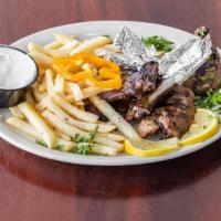 Lamb Chops · 4 pieces of chops grilled served with rice or fries.