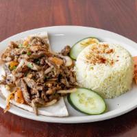 Beef Shawarma Plate · Served with rice or fries, along with a choice of salad, hummus, Baba Ganoush.