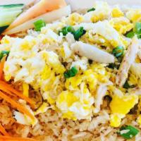Crabmeat Fried Rice · Fresh crab meat, stir-fried with jasmine rice, scallions, onions, and eggs (caution may cont...