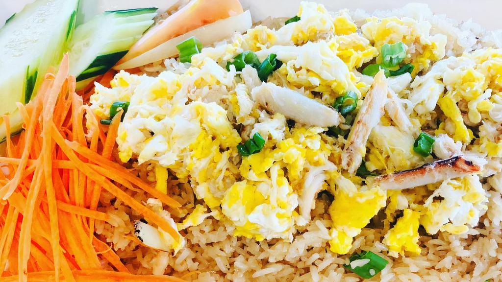 Crabmeat Fried Rice · Fresh crab meat, stir-fried with jasmine rice, scallions, onions, and eggs (caution may contain crab shells).
