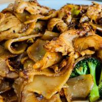 Pad Kee Mow · Big flat noodles stir-fried with tomatoes, white onions, bell peppers, broccoli, jalapenos, ...