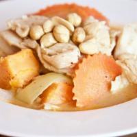 Massaman Curry · Massaman curry in coconut milk, sweet potatoes, carrots, onions, tomatoes, and peanuts. Rice...