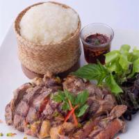 Marinated Steak · Bbq beef flank steak marinated with special house sauce served with a side of jeo som.