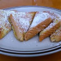French Toast · 6 Triangles of French Toast topped with powder sugar.