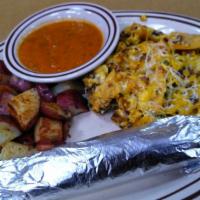 Migas · Scrambled eggs with tortilla chips, tomatoes, onions, jalapenos, cheese served with hash bro...
