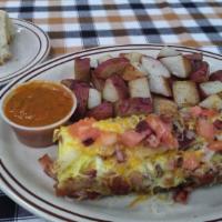Porkers Omelette · Ham, sausage, bacon, onions, tomatoes, and cheese with a side of salsa.